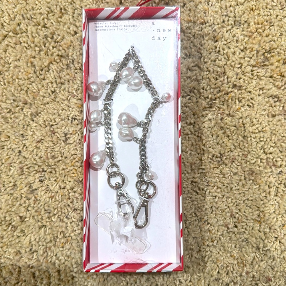 New in box A New Day Wristlet Strap for your phone, purse or clutch
